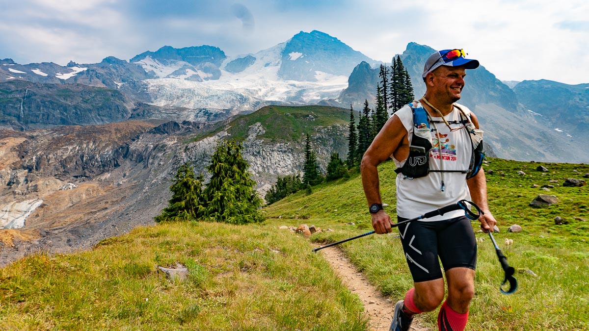 Man running with Mt. Rainier's Tahoma Glacier in the background