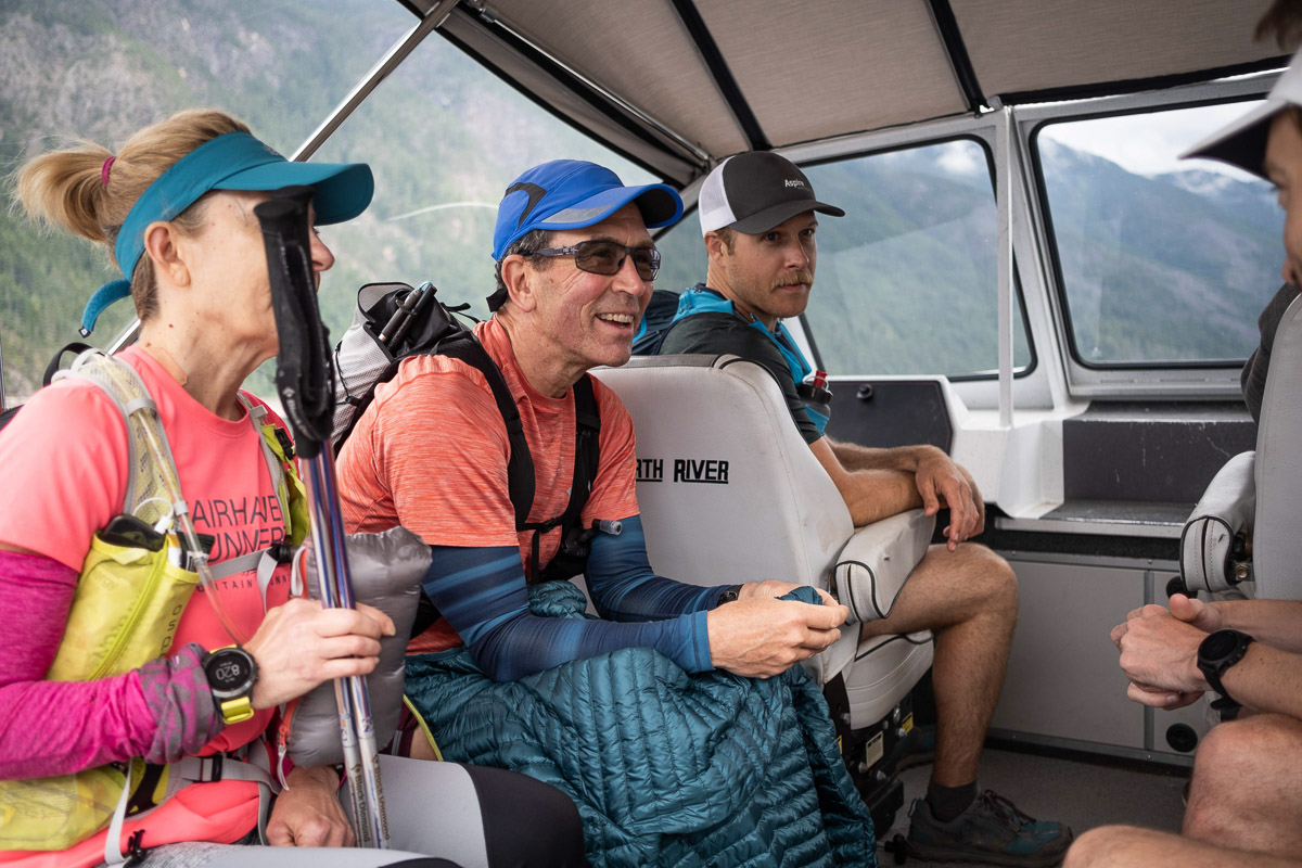 runners in the Ross Lake ferry in the north cascades