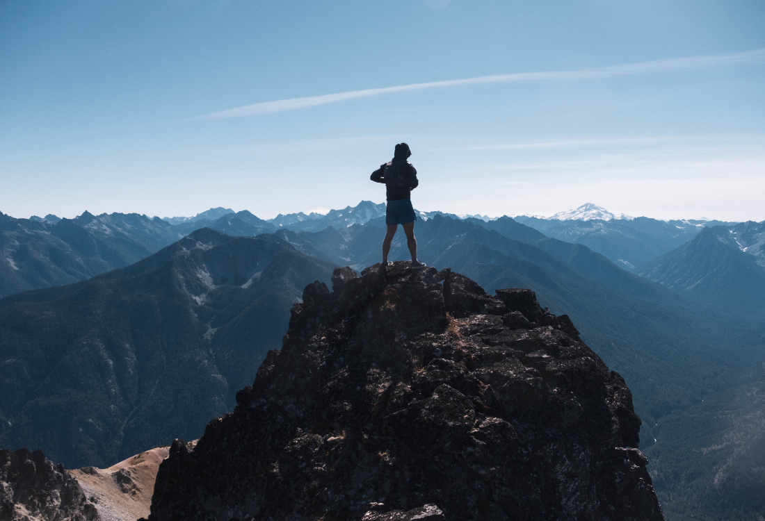 Showing a runner at the top of the North Cascades